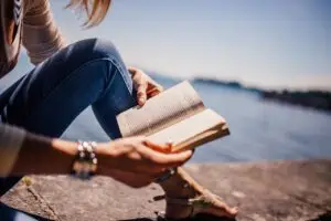 woman-by-lake-reading
